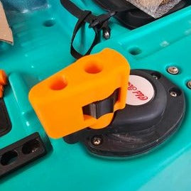 Photo of orange steering handle installed on blue Old Town kayak
