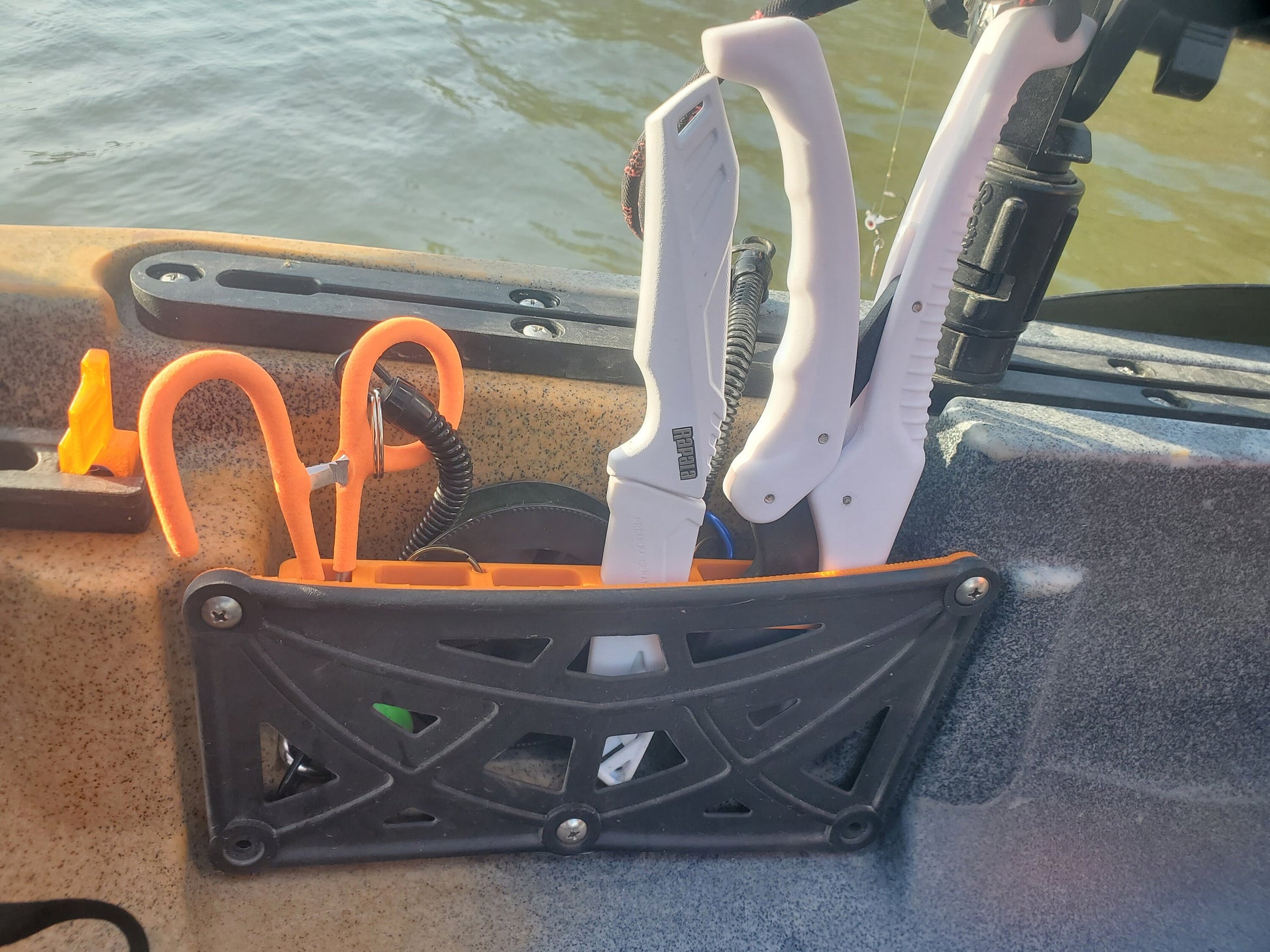 Photo showing tool holder holding tools in a kayak