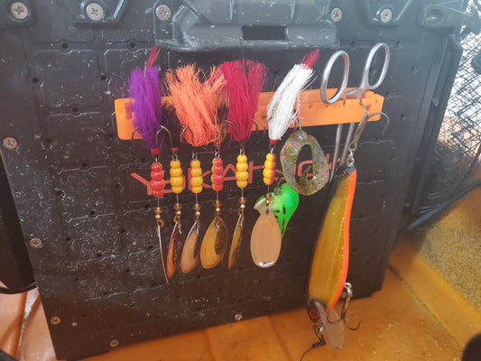 Photo of the lure hanger mounted on crate holding lures and tools